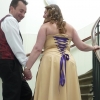 purple corset back on gold wedding gown