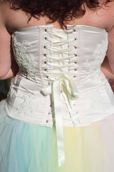 Pale pink corset with lace detailing and rainbow tulle skirt
