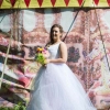 White tulle wedding gown with pastel rainbow layers