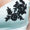 Black lace detailing on pale blue wedding dress