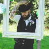 Groom with quirky waistcoat and bowler hat